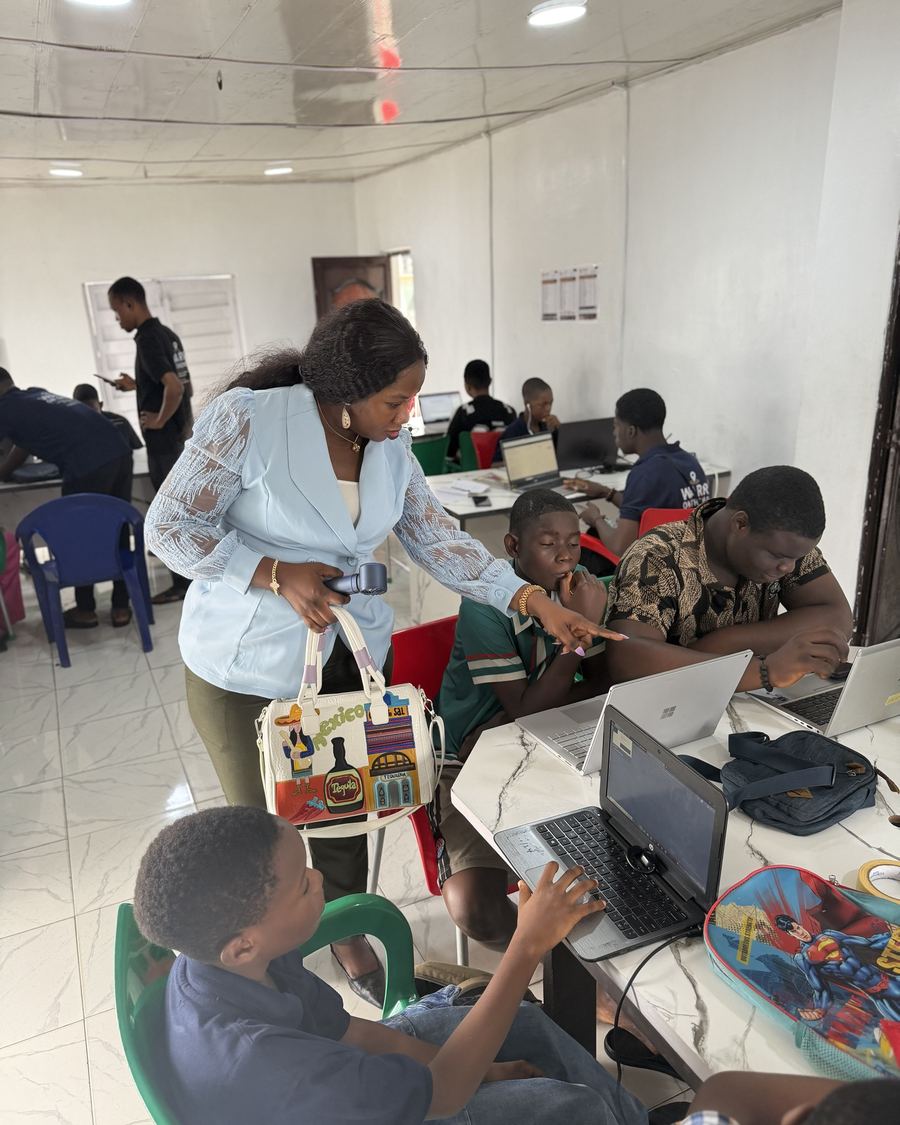 Founder guiding learners through a task