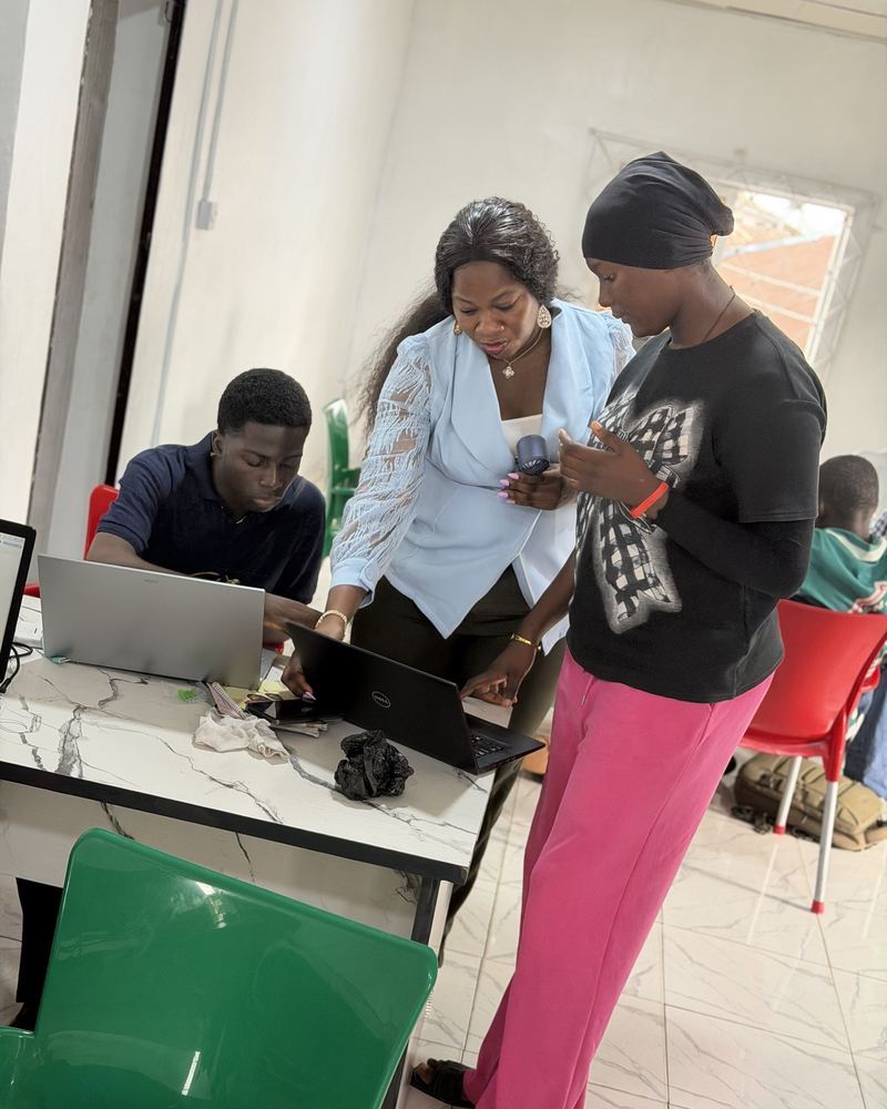 Flowealth learners working on a Graphic Design project