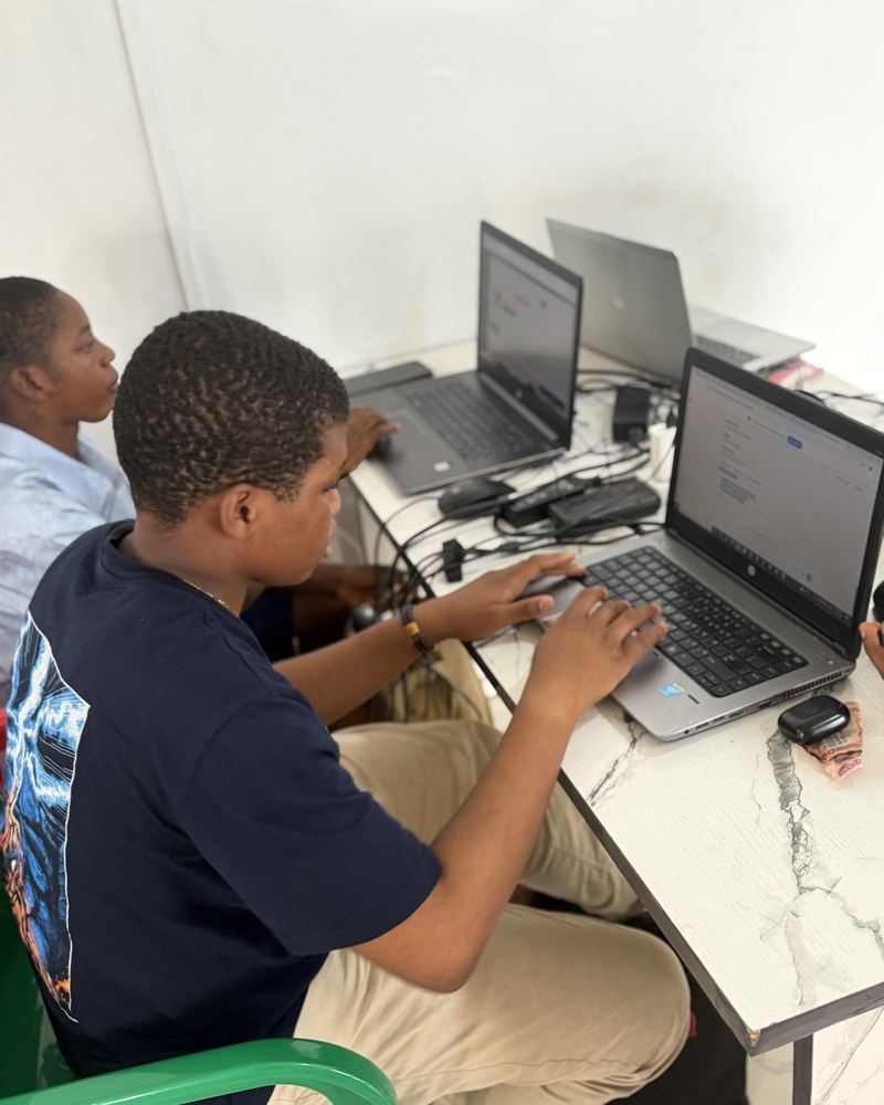 Flowealth learners working on a Web Design project